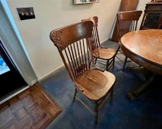Set of Six turn of the century pressed-back chairs wooden seats. with 8 spindles