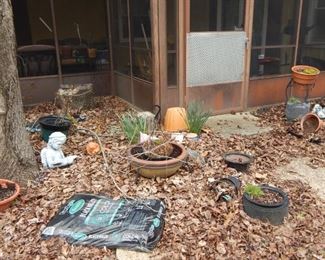Lots of garden pots and yard items.