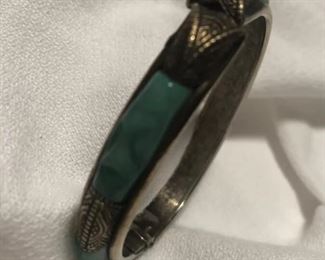 Brass and jade bracelet.
