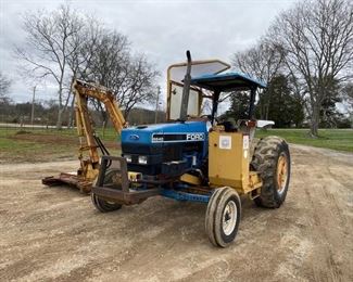 Ford tractor with side arm cutter