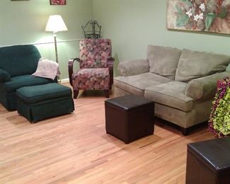 Light green loveseat w/patterned accent chair w/wooden arm rests; hunter green upholstered chair w/ottoman.