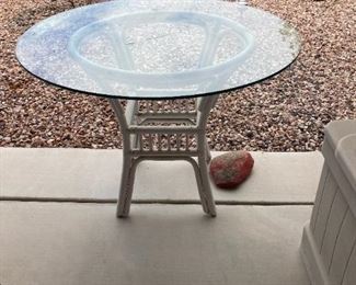 Patio table.  Wicker with glass top