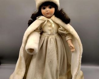 Marian Yu Designs doll
Vintage velvet winter white porcelain doll