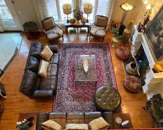 Lots of furniture for sale! Matching pair of chocolate color leather reclining sofas. Chocolate color leather round tufted ottoman by Ethan Allen. 100% wool handmade hand knotted large area rug. Extra large oil on canvas framed painting signed by artist. Maitland Smith consult table iron with natural Stone top. And so much more!