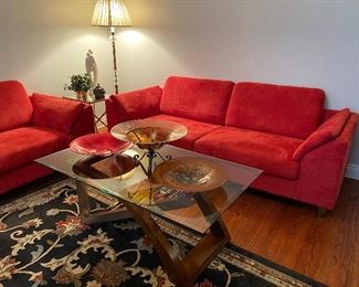 Pair of red modern contemporary sofas made in Canada! Wood and metal with glass top coffee table with matching complementary and table