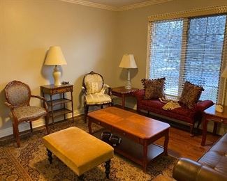 Lots of beautiful furniture! On the right side you will see a solid wood with tufted leather and rolled arms bench made by Lexington home furniture. On the left you’ll find a chair by Althrop. Lots of beautiful area rugs throughout the home for sale. 