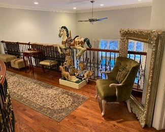 Oversized very ornate frame. Carousel horse. Long area runner rug. 
