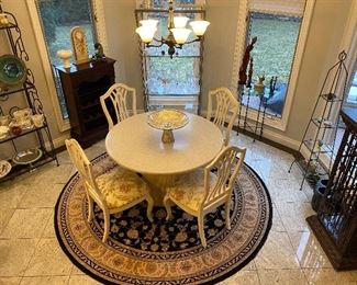 Thomasville furniture for chairs and table with stone top. Round wool area rug. Lots of kitchen goodies! For the wine lover we have three wine cabinets for sale…