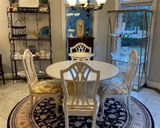 Thomasville furniture for chairs and table with stone top. Round wool area rug. Lots of kitchen goodies! For the wine lover we have three wine cabinets for sale…