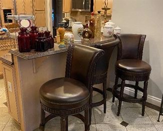 Set of three solid wood with leather upholstery swivel barstools by Frontgate furniture. Lots of kitchen items and kitchen accessories for sale! 