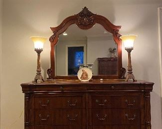 Solid wood Pulaski furniture 8 drawer dresser with matching mirror. Also has a matching tall chest of drawers and two matching nightstands and matching king size bed frame