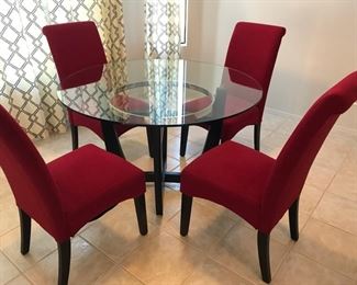 This is a wonderful glass top table with four chairs! Very gently and rarely used by a snowbird. This table and chairs are like brand new!!