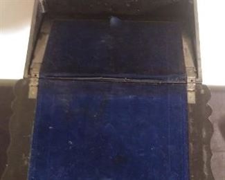 Sun Room:   The interior of the antique paper mache writing box has a royal blue velvet lining and several compartments.