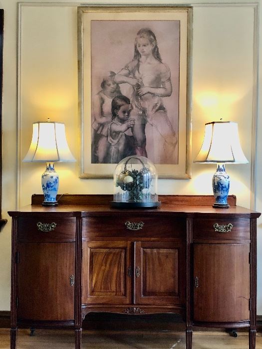 Dining Room:  A large charcoal drawing by listed artist Jon Corbino hangs above an antique sideboard (59" wide x 40" tall to back center carved shell x 24" deep). 
A pair of  blue/white porcelain lamps and a large antique glass cloche display dome on a wooden base  are also shown.  Closer photos follow.       