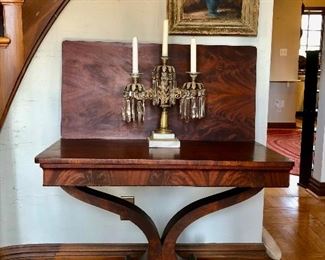 Entryway:  An antique 19th century Empire burl wood flip top  table is perfect for an entry hall, living room or dining room.  The vintage three-candle table sconce matches the lamp previously shown.  The framed vintage floral still life oil painting is better seen in the next photo.  