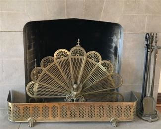 Living Room:  A vintage brass fireplace fender is priced separately from the vintage "peacock" fireplace screen and fireplace tool set.  Hidden behind the screen is a set of separately priced brass andirons. 