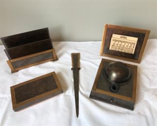 Sun Room:   The 5-piece ART DECO bronze desk set by "Silver Crest"  includes a letter holder; universal calendar; blotter; letter opener; and a pen holder/ink well. 