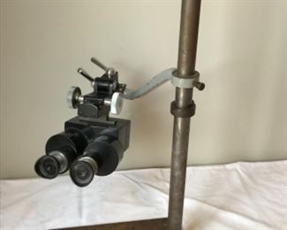 Sun Room:    Our physicist client created this adjustable/swing arm device by attaching am OLYMPUS  binocular-microscope to a steel pole and wooden base.  It has great depth perception! And, it is one-of-a-kind.