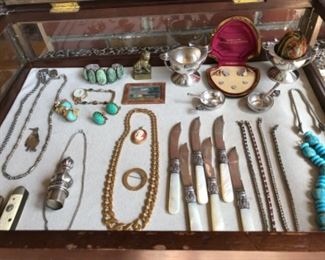 Sun Room-CASE:  The case includes costume jewelry; vintage Miriam Haskell earrings; mother-of-pearl handle fruit knives; and other collectibles.  More photos follow.