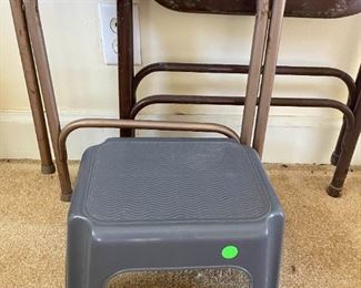 Two Metal Folding Chairs And A Small Stool