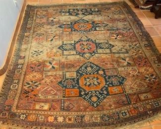 Item #261  $500   Antique Bakhtiar handwoven Persian rug, surface wear and some edge loss, 120" x 98