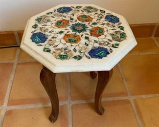 Item #197   $150    Small octagonal Pietra Dura table, semiprecious stone inlaid in white marble on detached base, 14"