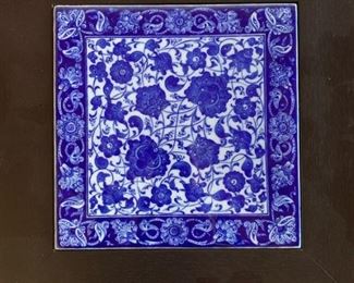 Item #184  $25   14 1/2" framed blue and white decorative tile