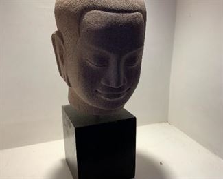 Item #263   $300   Mounted signed sandstone bust of Buddha on wooden stand from the Cambodian workshops of Les Artisans d'Angkor, 6 1/2", 10" with stand