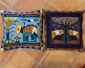Item #263  $60    African hand embroidered Shangaan cloth pillows made by a women's co-op (Kaross), 16 1/2" square