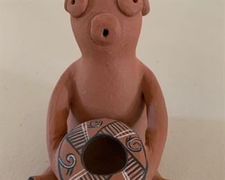 Item #143 $100    Alma L. Concha (Jemez/Taos 1941-) mudhead with pot, 4 1/4'' H
