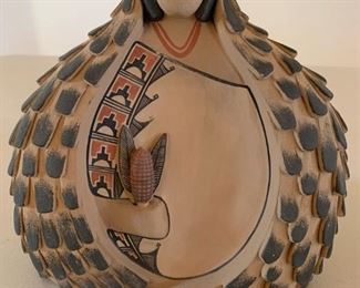 Item #128  $250    Maxine Toya (Jemez 1948-) polychrome  woman holding corn 7 3/4" x 7 1/2"