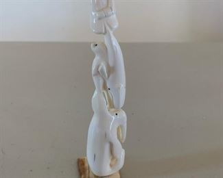 Item #135   $250   Inuit walrus tusk totem carving of hunter, whale, seal, and walrus, unsigned, 7"
