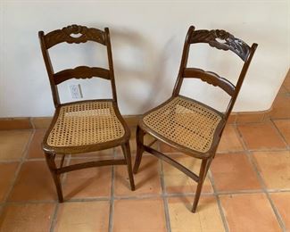 Item #479   $150/pair Antique carved and cane seat chairs