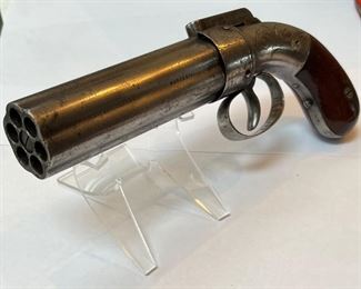 Item # 108
Antique Allen and Thurber Pepperbox Pistol This Allen and Thurber .32 caliber 6 shot Pepperbox pistol was manufactured around 1845. It is a box hammer percussion revolver pistol. Pepperbox pistols were so named because the front view of the weapon was so reminiscent of a Pepper Pot of the time being a circle of round holes. This example was made by Ethan Allen of Massachusetts. Allen developed his gun business by taking his brother-in-law Charles Thurber as his partner, and they moved the plant to Worcester, Mass. Ethan Allen applied for various patents, most notably early on for a "TUBE HAMMER" ignition system in 1837, which was renewed in 1845. This is a very nice example of this style of pistol. Price $1850