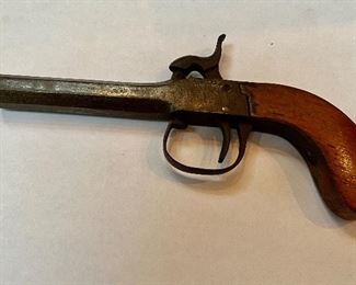 Item #113 Antique cap and Ball Percussion Pistol. These pistols were commonly used in the early to middle 1800’s. The octagon barrel brought form and beauty. Popular with travelers and gamblers alike, they were easily concealed in a pocket. They were also used to solve disputes in duals. This appears to be a .36 caliber, and appears to be functional. It’s a great example of an 1800’s antique cap and ball percussion pistol. Price. $750