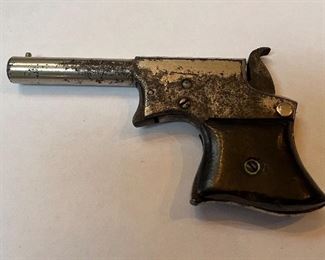 Antique Remington Saw Tooth Pocket Derringer Very early production Remington Vest Pocket Pistol (aka Number 1 Saw Handle Derringer) .30 caliber Rimfire, with rosewood grips. The bore has a little pitting in it with strong rifling, grips are original rosewood. Manufactured between 1850 - 1860. This pistol seems to be mechanically sound and all original, which is impressive for an item that is at least 160+ years old. This is would be an excellent addition for someone that collects early Remington handguns. Price $850