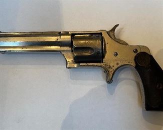 Item # 111 Antique Remington Smoot #3 Revolver This is an early production Remington Smoot #3 in .38 caliber Rimfire. It was manufactured around 1873. It retains 90+ % of its original factory nickel finish. It has a sleek appearance and an octagon barrel. It is tight and appears to operate as designed. It is a fine example of a Remington Smoot. This little beauty is a great glimpse into what post civil era personal protection looked like. This 149 year old, single action, 5 shot revolver is still tight and functional. It fires an antique .38 caliber short , rimfire shell. Price $1000