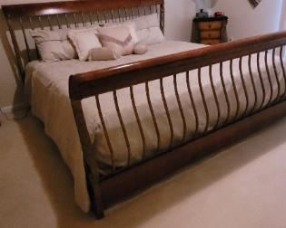 King wood and metal bed