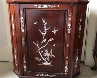 Asian Teak side cabinet with mother of pearl inlaid designs. 