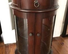 Circular wood and glass side table.