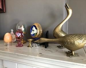 Laughing brass ducks are eye catchers on any mantel