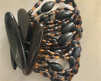 $100 Gerda  Lynggaard for Monies multi strand bracelet with disc.  8"L and 2.5"W 