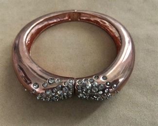 $50 Alexis Bittar encrusted crystal copper tone bangle bracelet  with original pouch.  Size: 2.5"x3" 