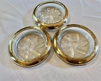 $60 Sterling silver coasters. Each 4.5" diam. 