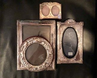 $50 ea (Top $40) Sterling silver picture frames.  Top: SOLD  Round bottom: SOLD  5.75" diam.  Left center: 8.75" H x 6.75" W. Right center SOLD  : 7.75" H x 4.75"W.