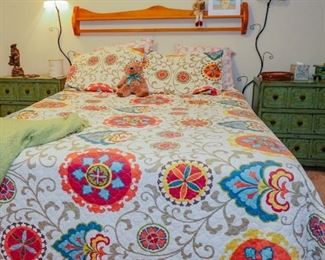 Queen bed with a pair of side chests