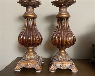 Pair of gold and amber glass candlesticks, $20