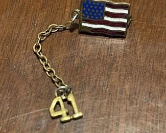small american flag pin with chain to a 41 vintage