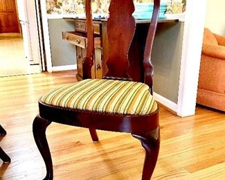 One of eight dining room chairs--fantastic carving