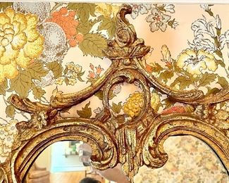 top pediment of carved gilt mirror